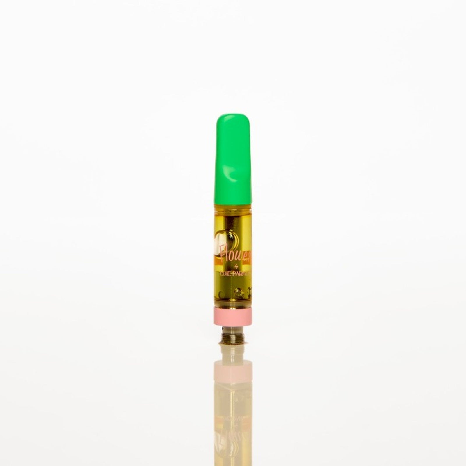 A single small vape oil cartridge with a bright green mouthpiece and clear body showing golden-yellow oil, centered on a seamless white background with a soft reflection below.